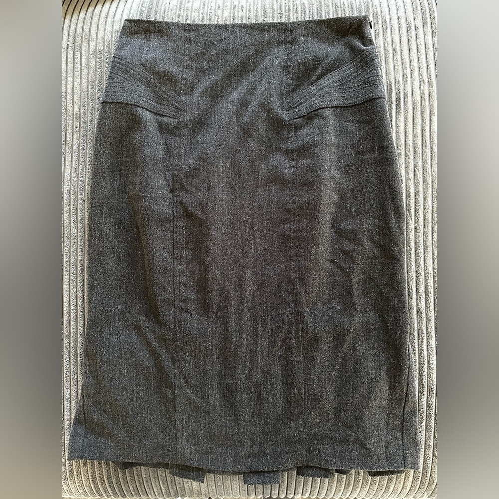 2000’s, tight fit with a pleated flair in the back.